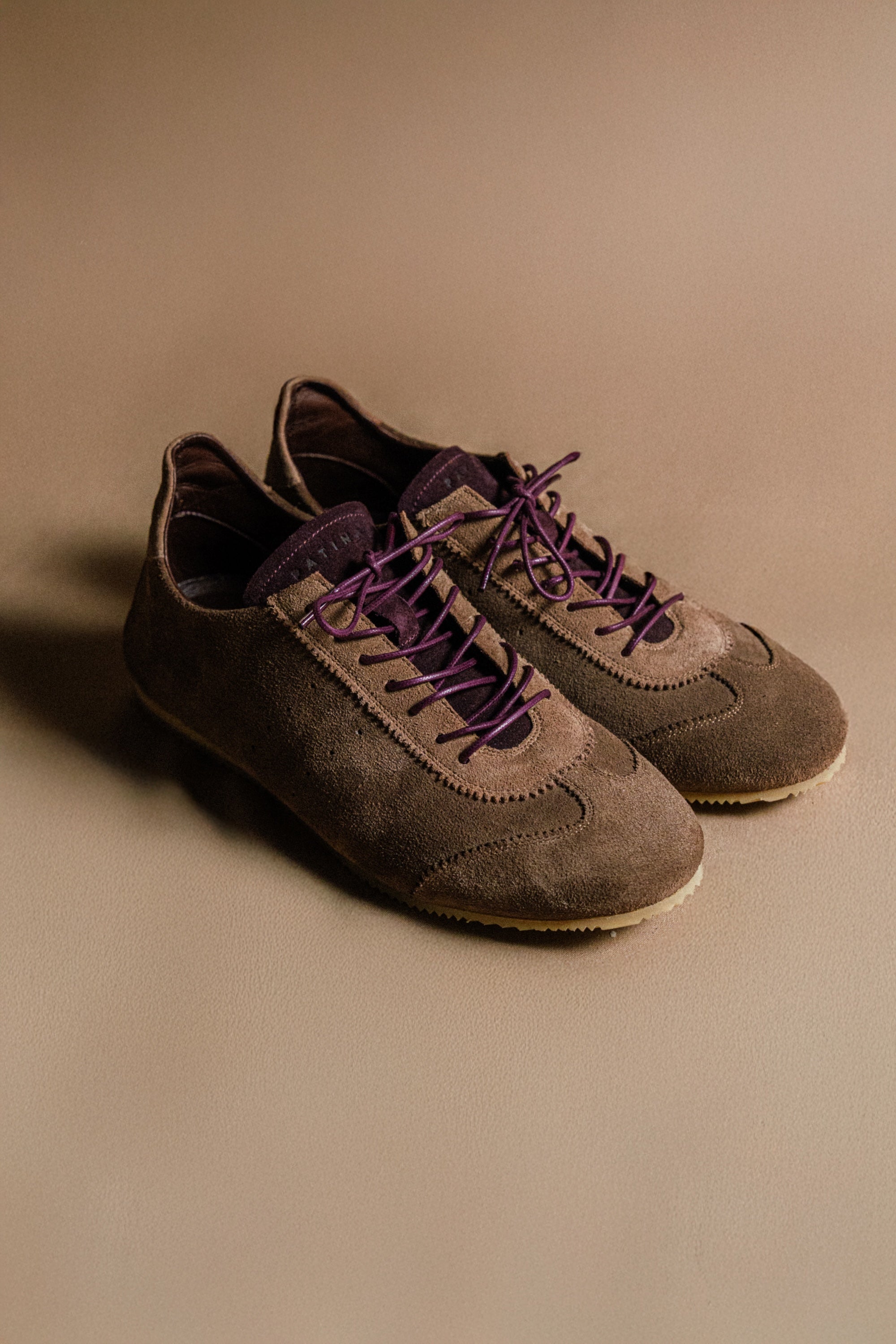 Brown and burgundy suede